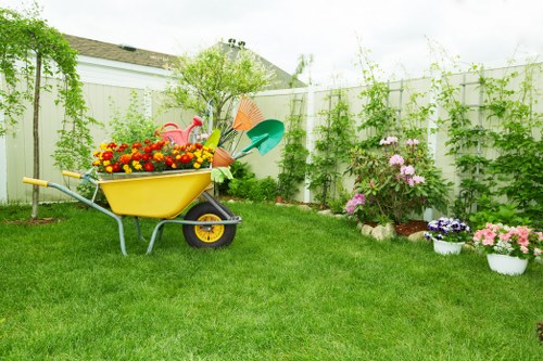Gardener testing soil in a Lewisham garden